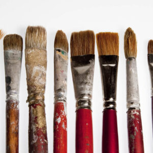 Six small used paint brushes