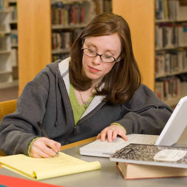 A female student studying in the library