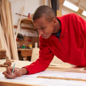 A young black male creating a construction layout