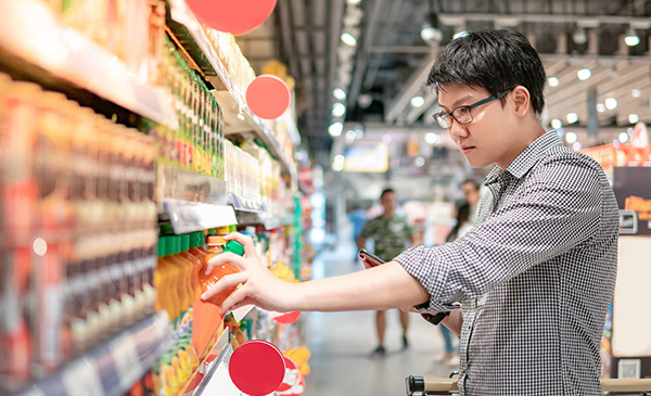 young asian man grocey shopping