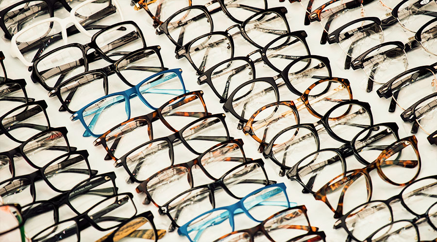 various eyeglass frames laid out on a table